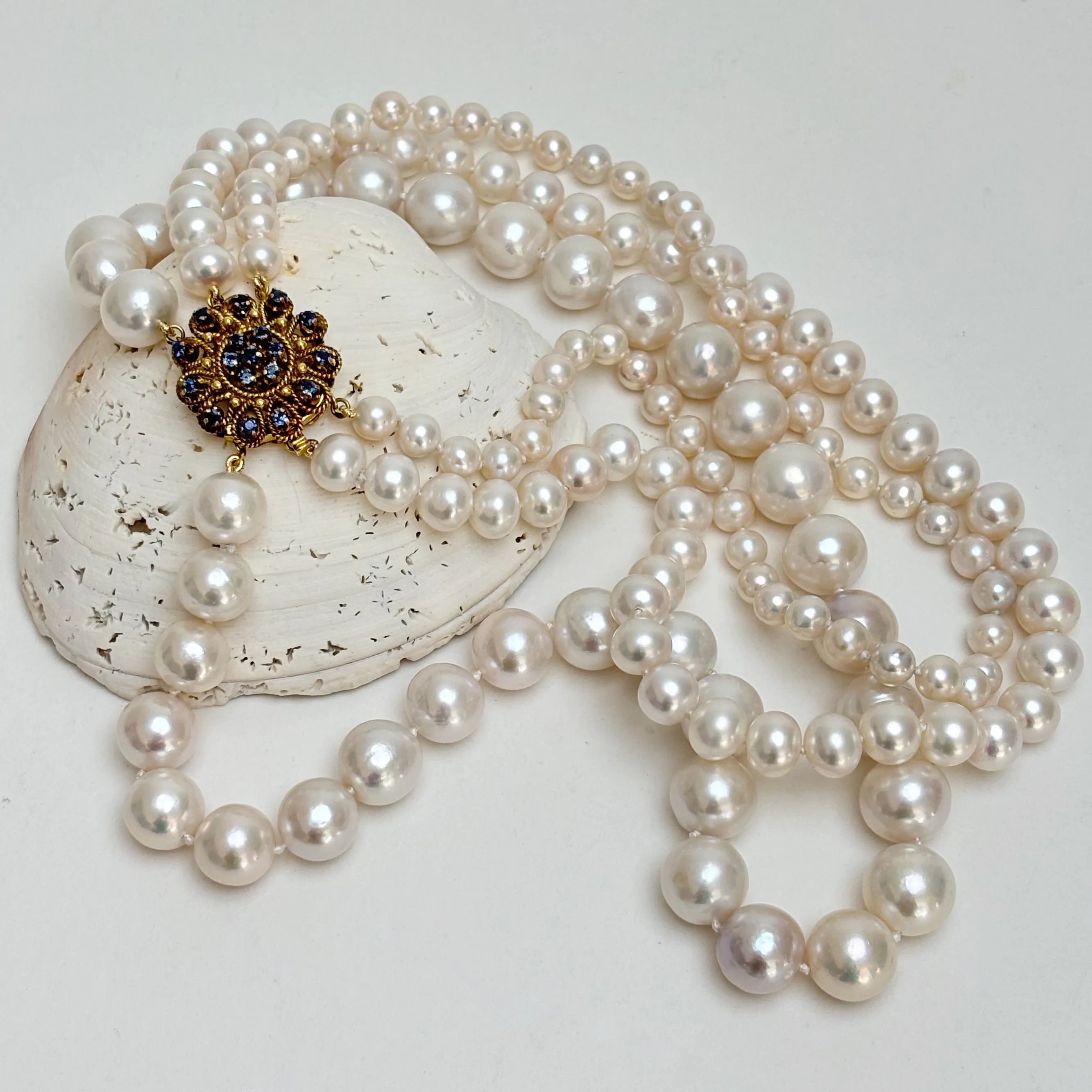 always classy three strand pearl necklace with vintage clasp