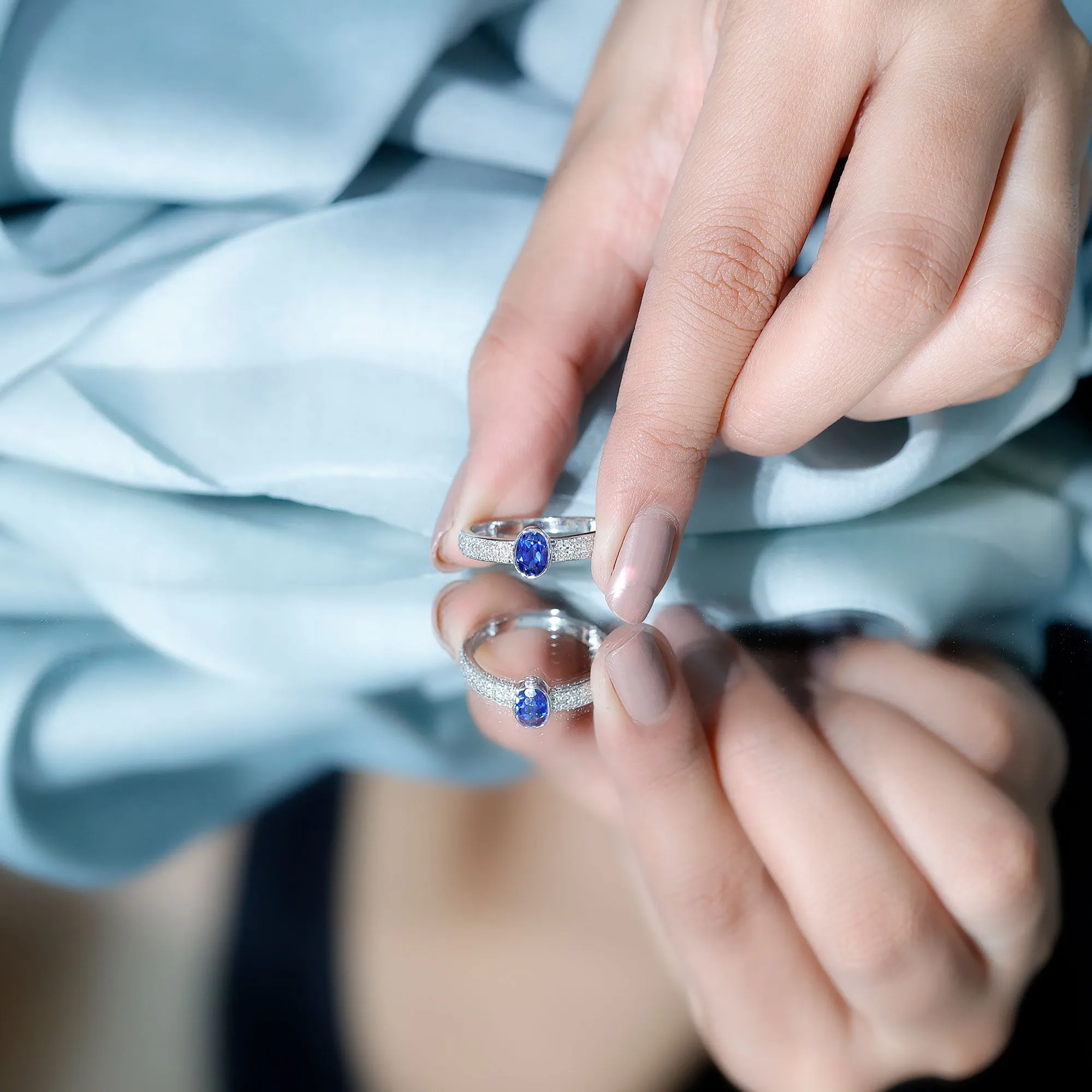 Oval Created Blue Sapphire Solitaire Engagement Ring with Diamond Side Stones