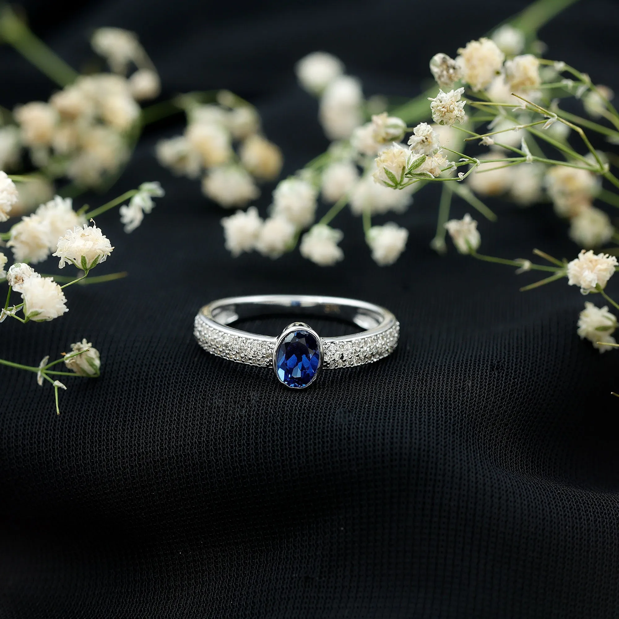 Oval Created Blue Sapphire Solitaire Engagement Ring with Diamond Side Stones