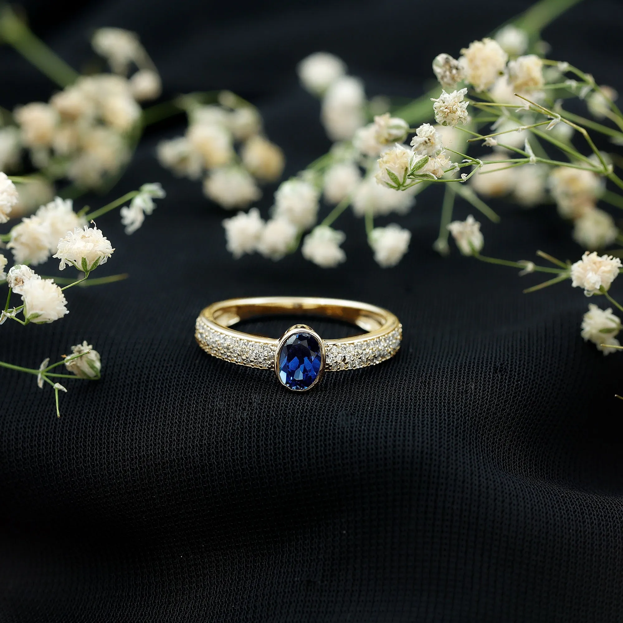 Oval Created Blue Sapphire Solitaire Engagement Ring with Diamond Side Stones