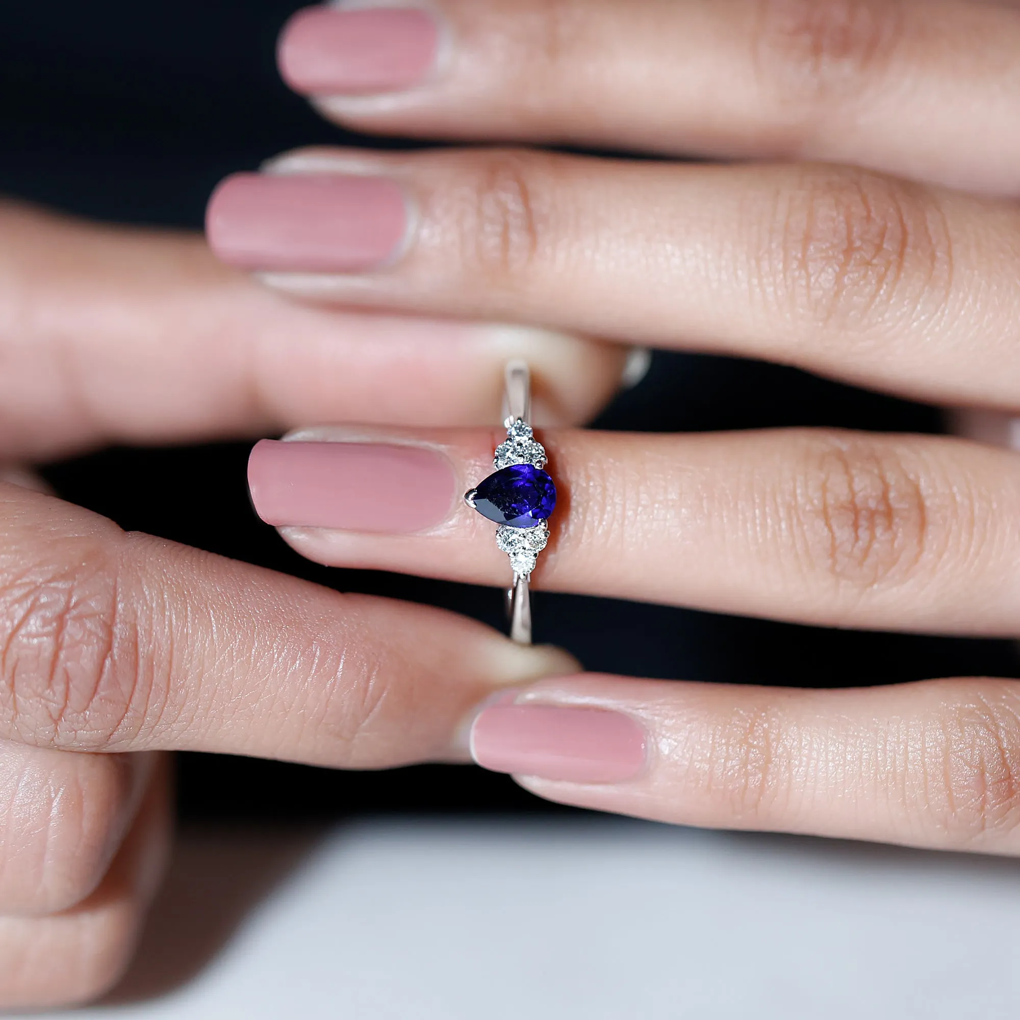 Pear Shaped Created Blue Sapphire Solitaire Ring with Diamond Trio